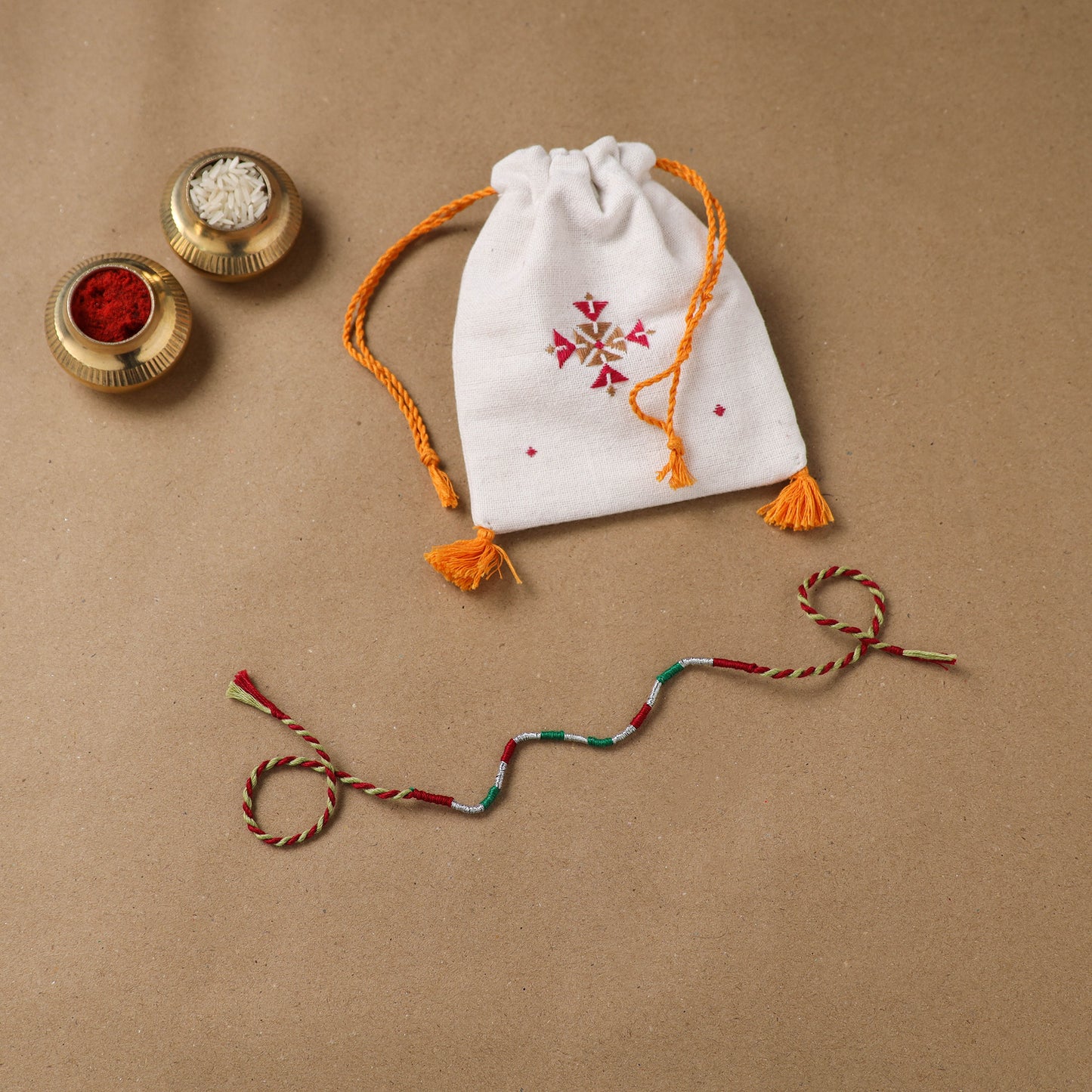 Anant Raksha Thread Work Rakhi with Soof Hand Embroidered Potli 25