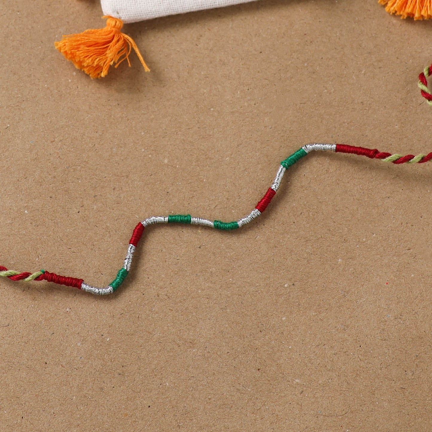 Anant Raksha Thread Work Rakhi with Soof Hand Embroidered Potli 25