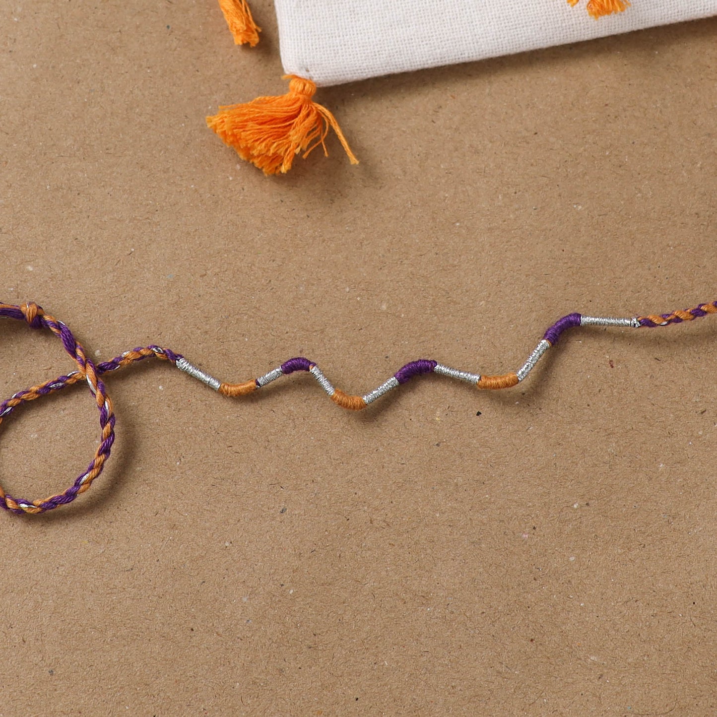Anant Raksha Thread Work Rakhi with Soof Hand Embroidered Potli 27