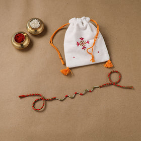 Anant Raksha Thread Work Rakhi with Soof Hand Embroidered Potli 28