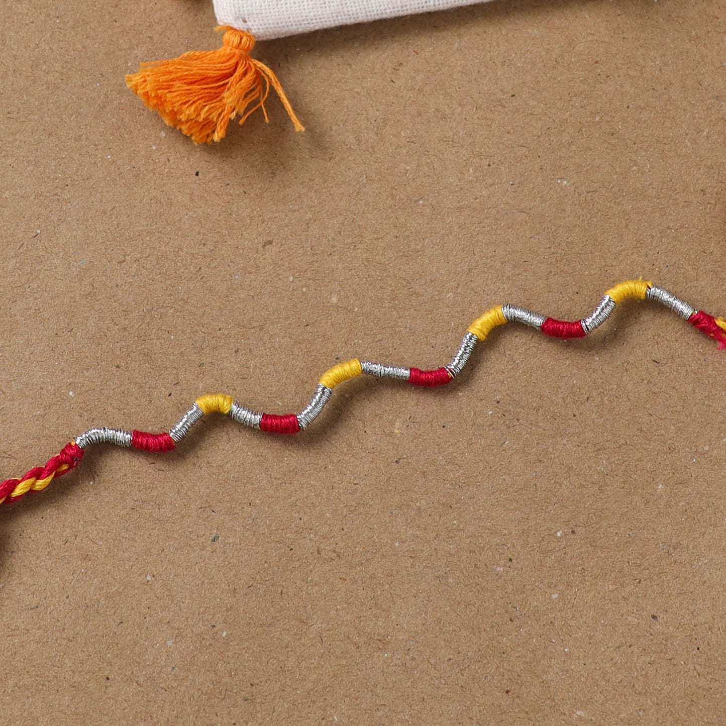 Anant Raksha Thread Work Rakhi with Soof Hand Embroidered Potli 29