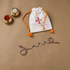 Anant Raksha Thread Work Rakhi with Soof Hand Embroidered Potli 30