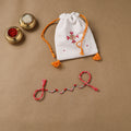 Anant Raksha Thread Work Rakhi with Soof Hand Embroidered Potli 32