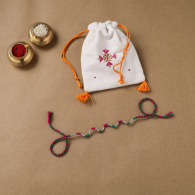 Anant Raksha Thread Work Rakhi with Soof Hand Embroidered Potli 33