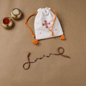 Anant Raksha Thread Work Rakhi with Soof Hand Embroidered Potli 36