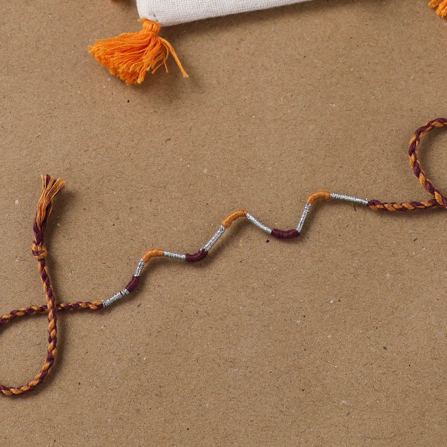 Anant Raksha Thread Work Rakhi with Soof Hand Embroidered Potli 36