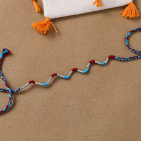 Anant Raksha Thread Work Rakhi with Soof Hand Embroidered Potli 37