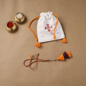 Anant Raksha Thread Work Lumba Rakhi with Soof Hand Embroidered Potli 39