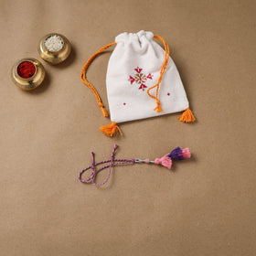 Anant Raksha Thread Work Lumba Rakhi with Soof Hand Embroidered Potli 40
