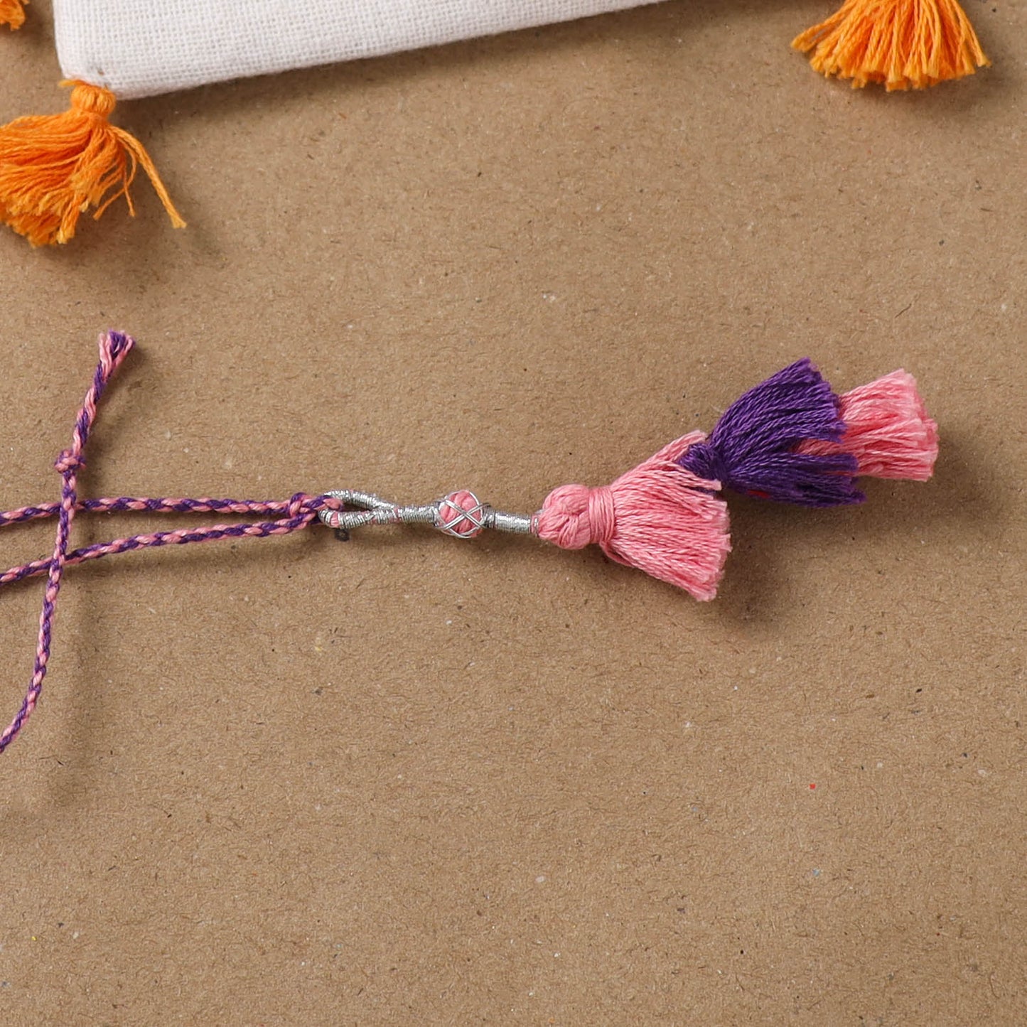 Anant Raksha Thread Work Lumba Rakhi with Soof Hand Embroidered Potli 40