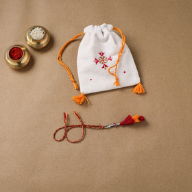 Anant Raksha Thread Work Lumba Rakhi with Soof Hand Embroidered Potli 41