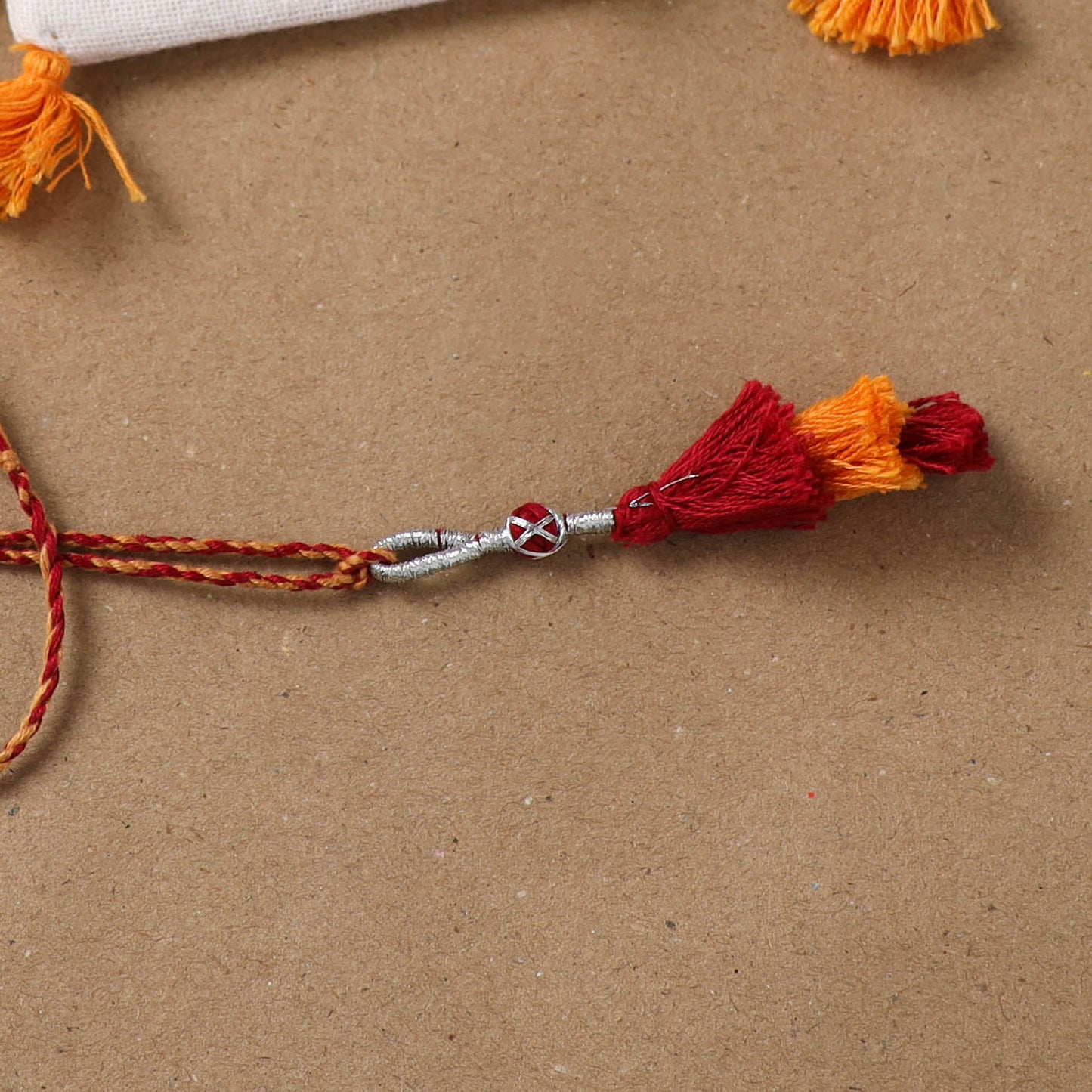 Anant Raksha Thread Work Lumba Rakhi with Soof Hand Embroidered Potli 41