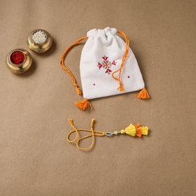 Anant Raksha Thread Work Lumba Rakhi with Soof Hand Embroidered Potli 43