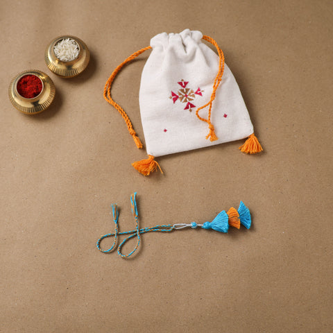 Anant Raksha Thread Work Lumba Rakhi with Soof Hand Embroidered Potli 47