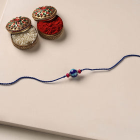 Handmade Blue Pottery & GS Bead Work Rakhi 01