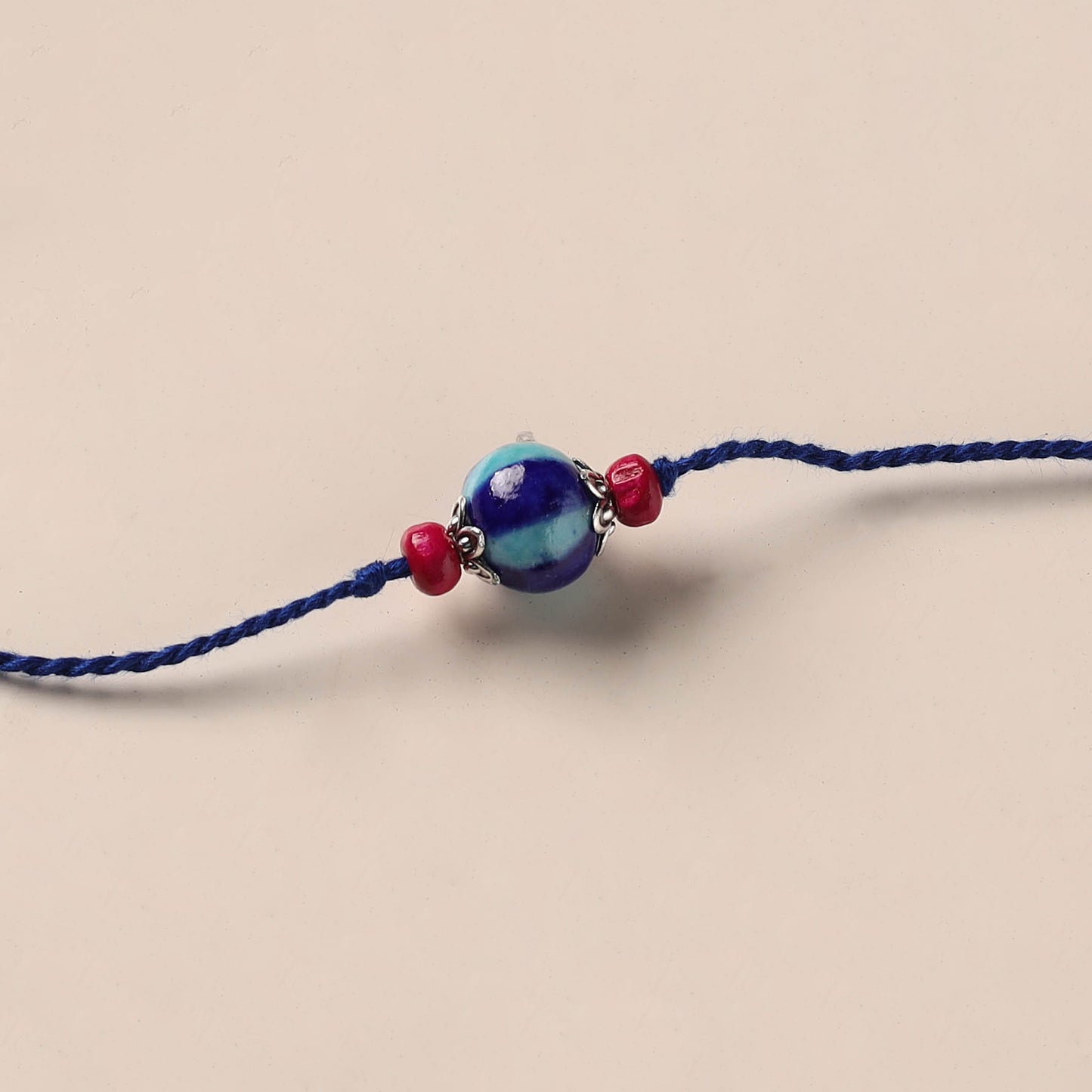 Handmade Blue Pottery & GS Bead Work Rakhi 01