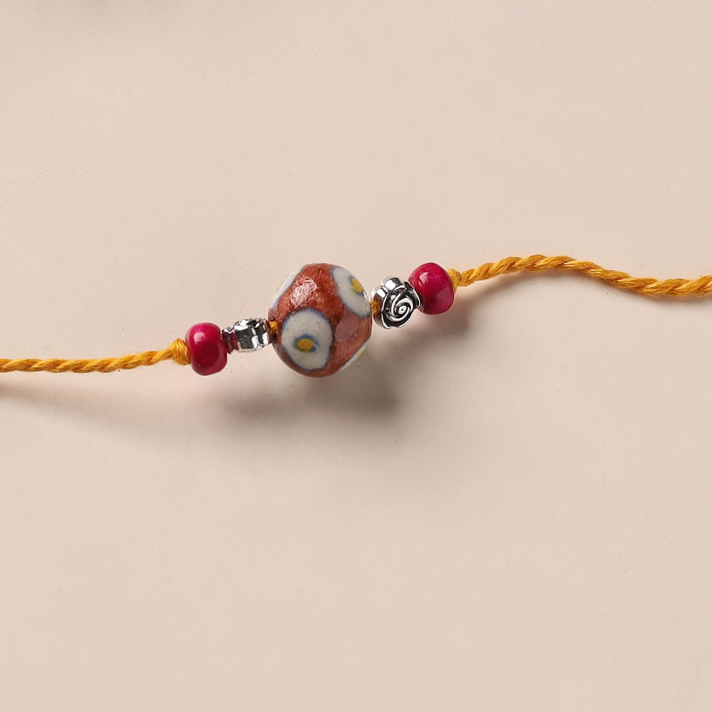 Handmade Blue Pottery & GS Bead Work Rakhi 03