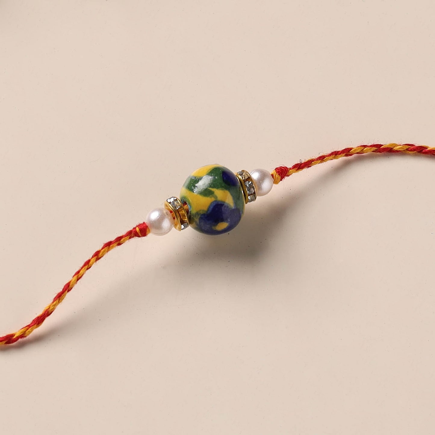 Handmade Blue Pottery & GS Bead Work Rakhi 05