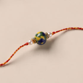 Handmade Blue Pottery & GS Bead Work Rakhi 05