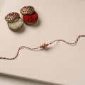 Handmade Blue Pottery & GS Bead Work Rakhi 06