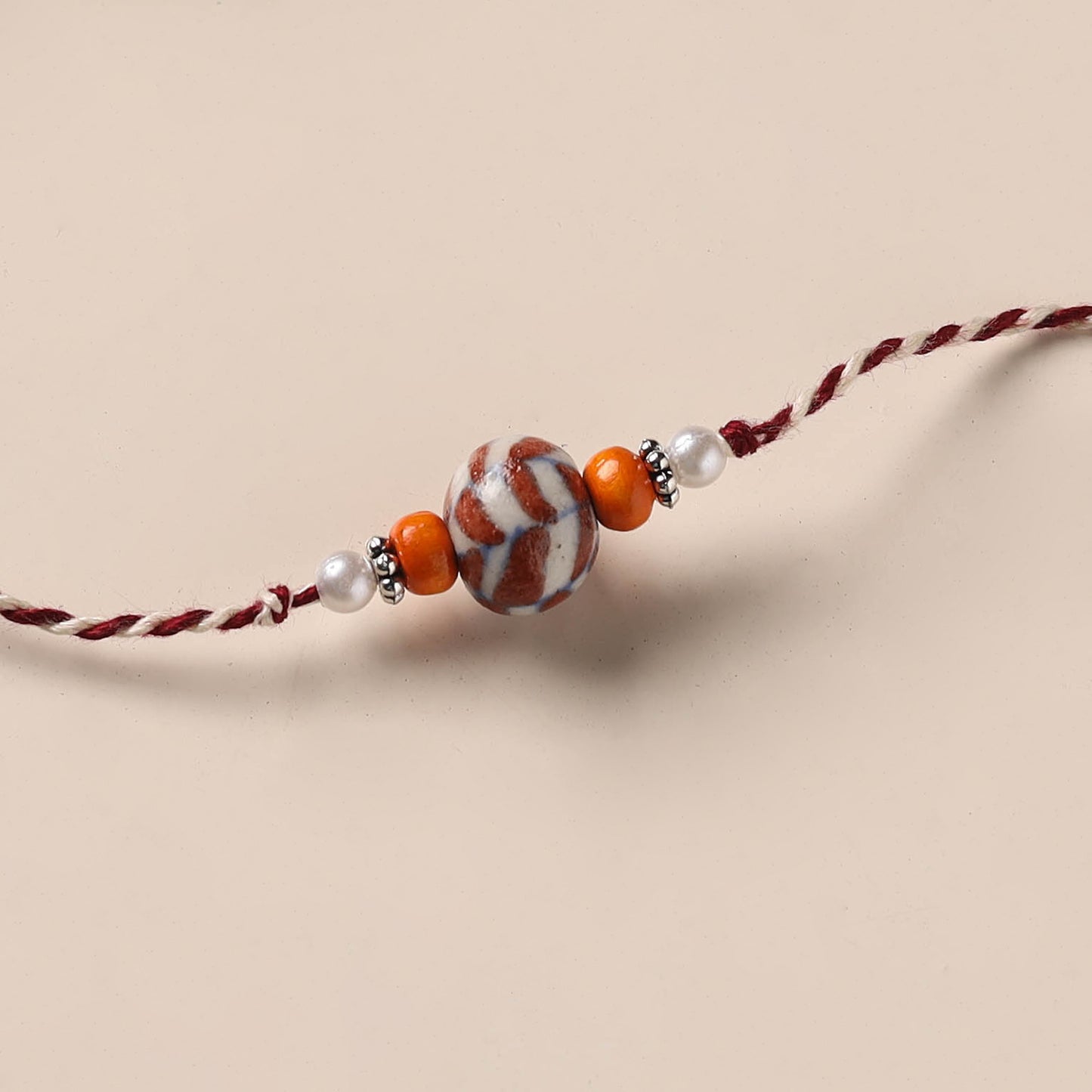 Handmade Blue Pottery & GS Bead Work Rakhi 06