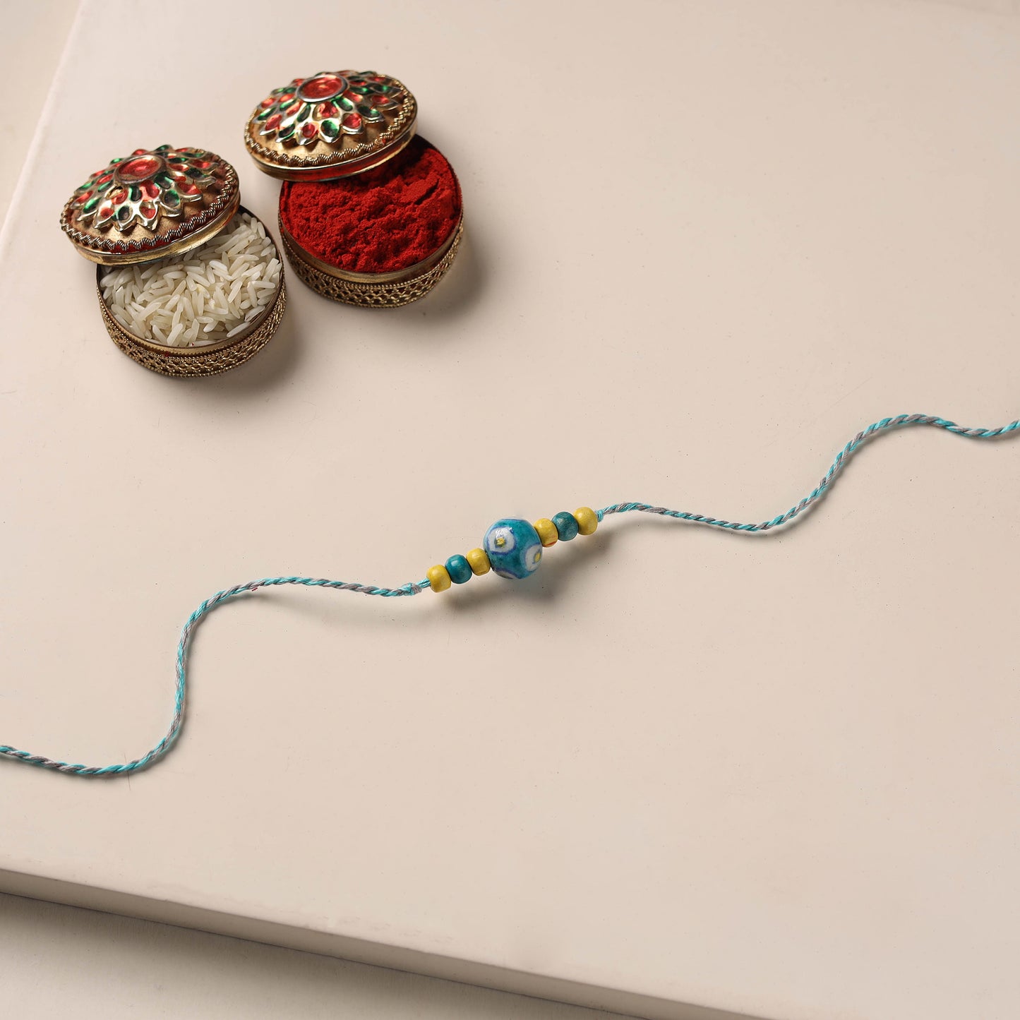 Handmade Blue Pottery & GS Bead Work Rakhi 07