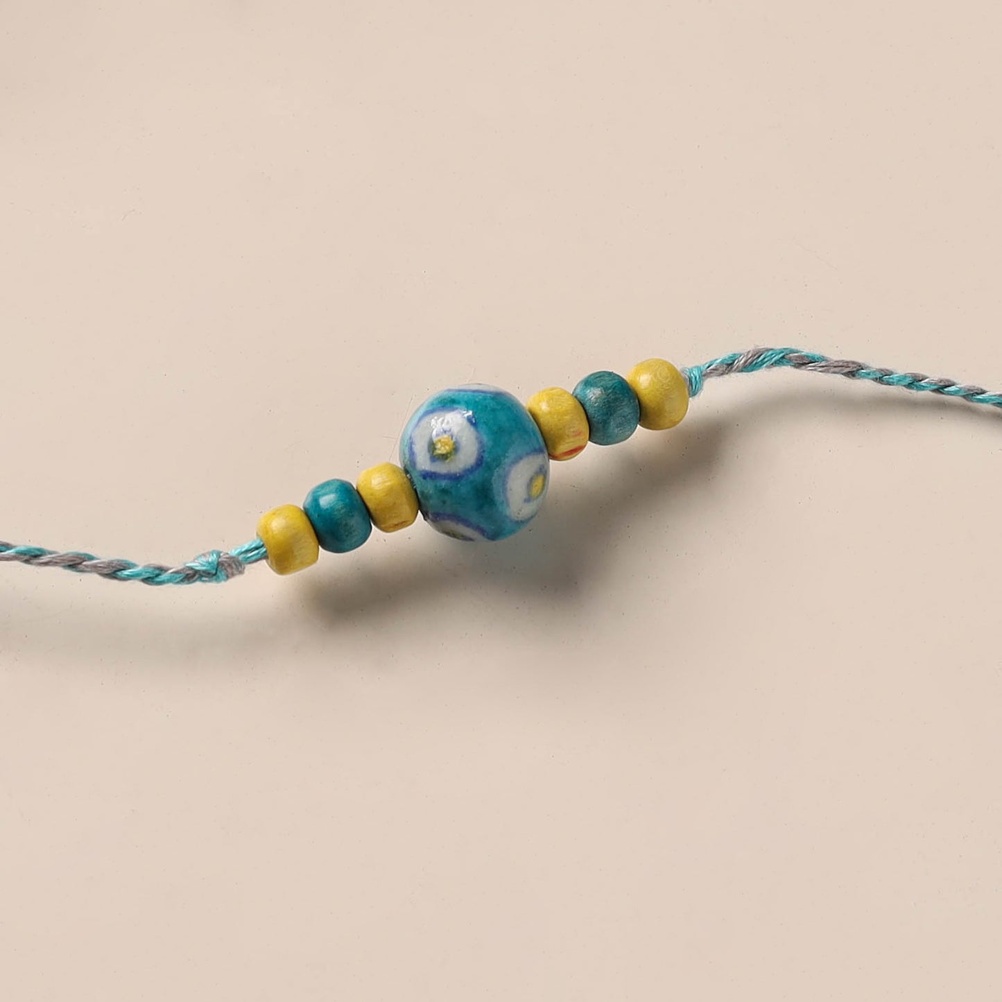 Handmade Blue Pottery & GS Bead Work Rakhi 07