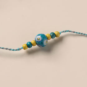 Handmade Blue Pottery & GS Bead Work Rakhi 07