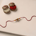 Handmade Blue Pottery & GS Bead Work Rakhi 08