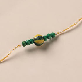 Handmade Blue Pottery & GS Bead Work Rakhi 09