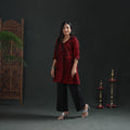 Front full-length view of a maroon Batik cotton short kurta with black crackle print, on a model