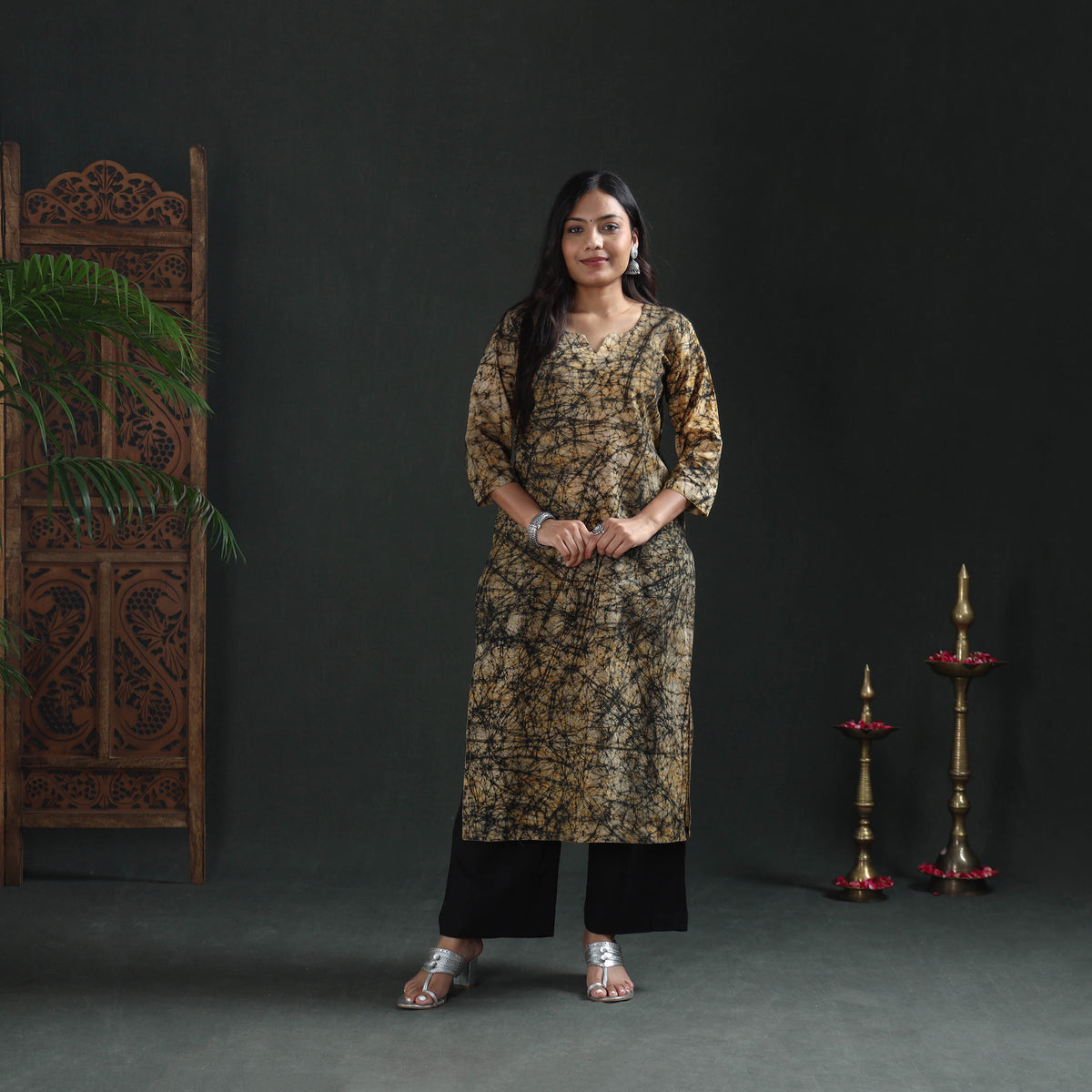 Full-length front of the beige batik kurta over black palazzos, styled as casual wear