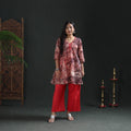 Front full-length view of the cream batik cotton kurta with red, pink and navy web print, on a model
