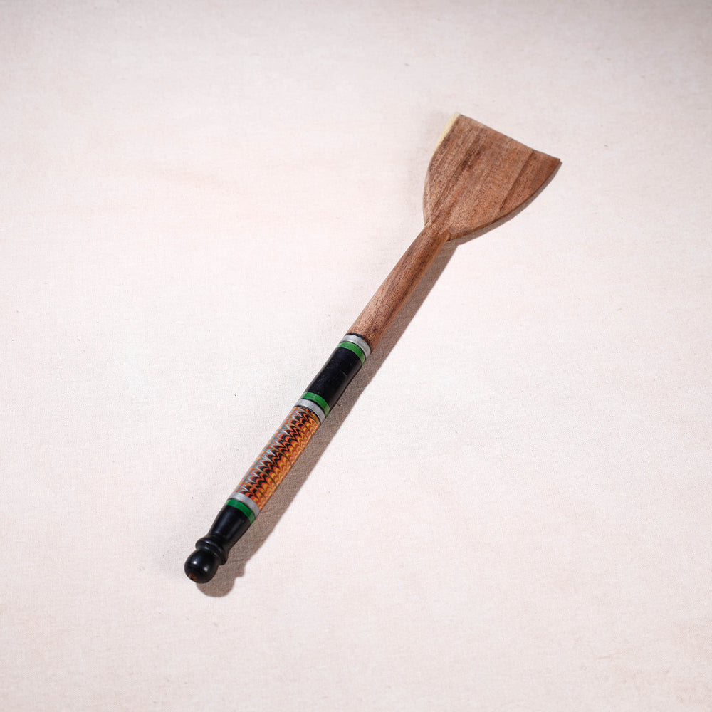 lacquered wooden spatula