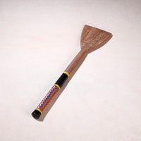 lacquered wooden spatula