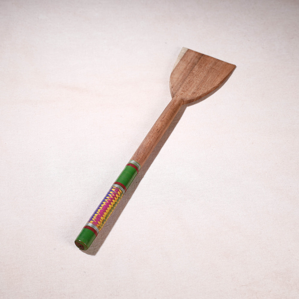 lacquered wooden spatula