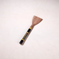 lacquered wooden spatula