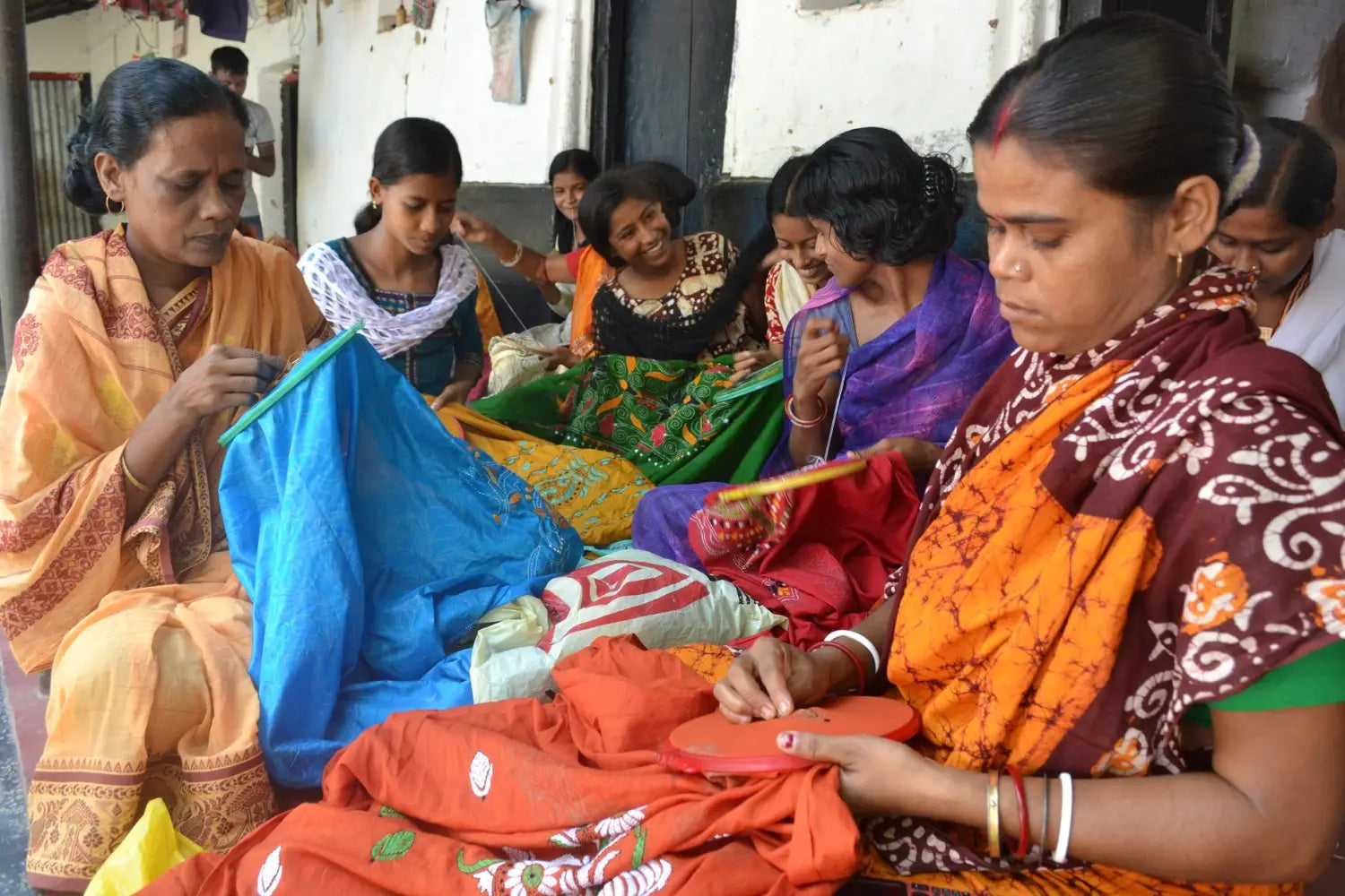 Women doing kantha stiches
