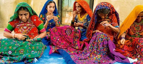 women doing kutch embroidery