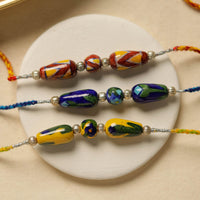 Patwa Threadwork Blue Pottery Beads Rakhi (set of 3) 06