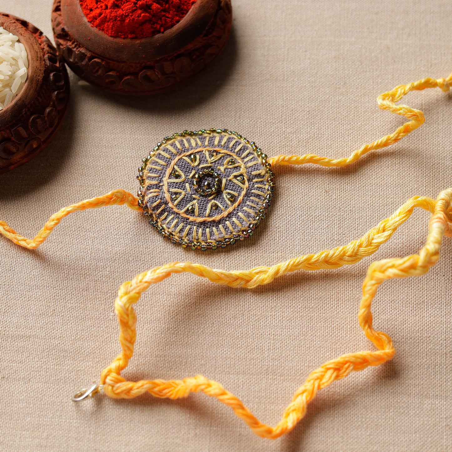 Beads & Thread Embroidered Reusable Rakhi by Neeli Titlee