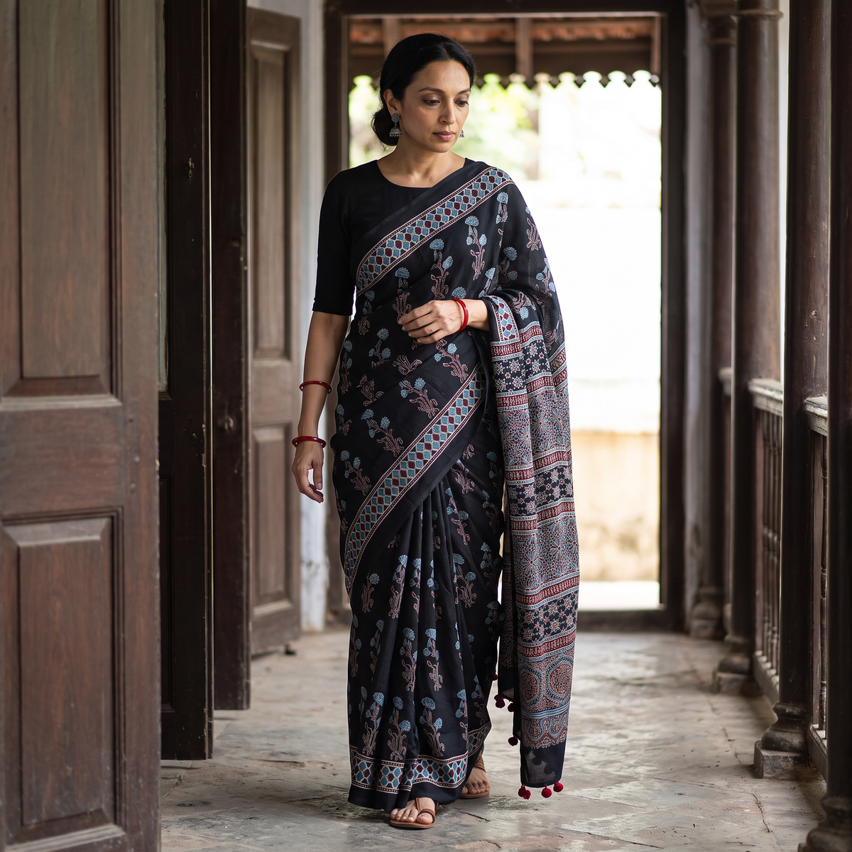 Black Ajrakh Hand Block Print Natural Dyed Modal Silk Saree, draped and worn by a woman, AI visual of the saree, iTokri