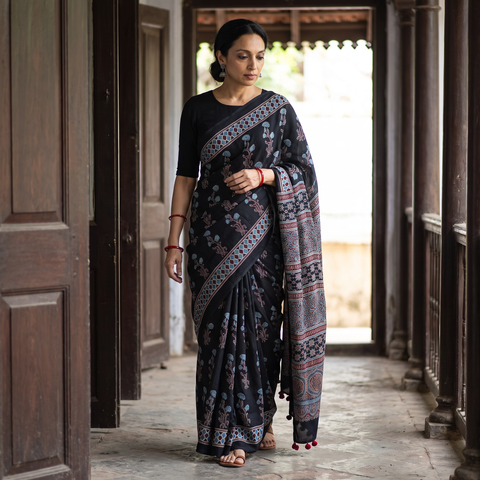 Black Ajrakh Hand Block Print Natural Dyed Modal Silk Saree, draped and worn by a woman, AI visual of the saree, iTokri
