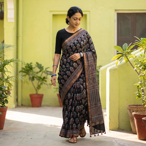 Black Ajrakh Hand Block Print Natural Dyed Zari Border Chanderi Silk Saree, draped and worn by a woman, AI visual of the saree, iTokri