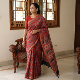 Red Ajrakh Hand Block Print Natural Dyed Zari Border Chanderi Silk Saree, draped and worn by a woman, AI visual of the saree, iTokri