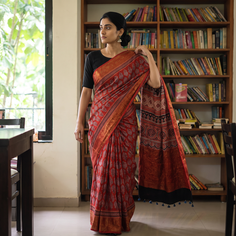 Red Ajrakh Hand Block Print Natural Dyed Zari Work Chanderi Silk Saree, draped and worn by a woman, AI visual of the saree, iTokri