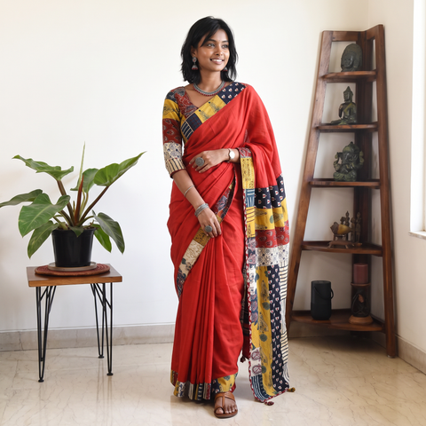 Red Ajrakh Hand Block Print Patchwork Pure Mul Cotton Saree, draped and worn by a woman, AI visual of the saree, iTokri