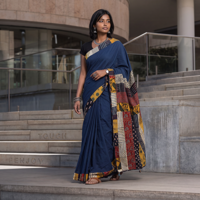 Blue Ajrakh Hand Block Print Patchwork Pure Mul Cotton Saree, draped and worn by a woman, AI visual of the saree, iTokri