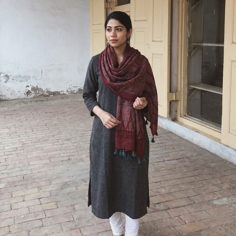 Maroon Ajrakh Hand Block Printed Pure Woolen Stole, worn by a woman, AI visual of the stole, iTokri