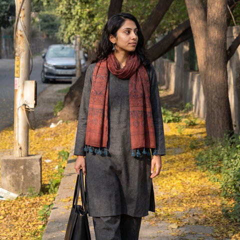 Maroon Ajrakh Hand Block Printed Pure Woolen Stole, worn by a woman, AI visual of the stole, iTokri